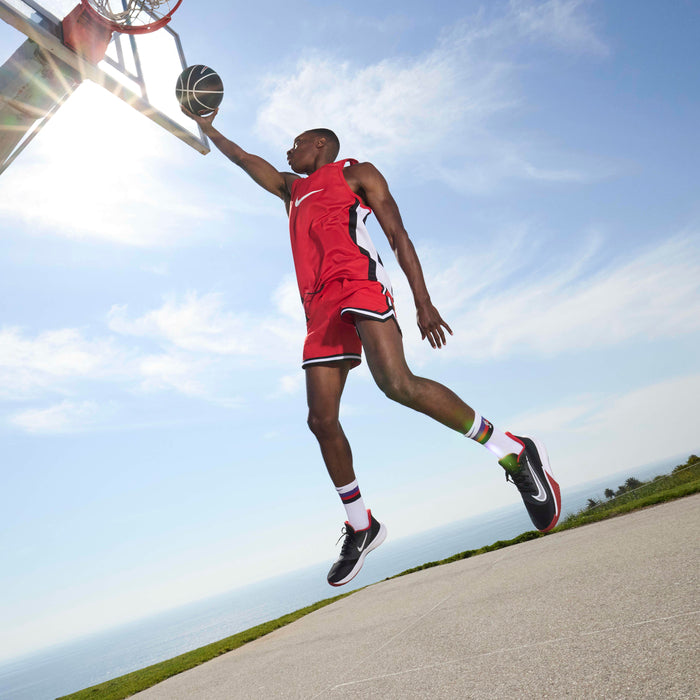 Nike Precision 7 basketball shoes Unisex in black and university red.