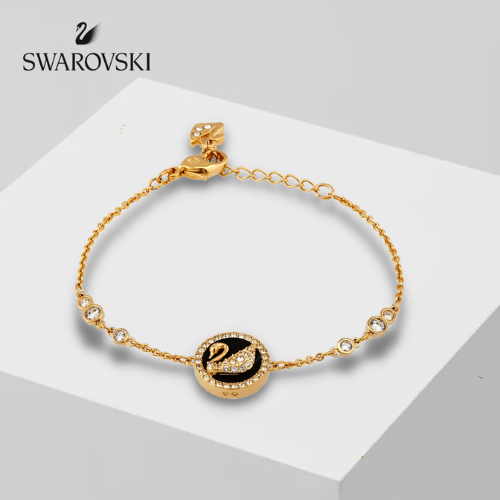 Swarovski Iconic Swan bracelet features a gold-tone plated chain