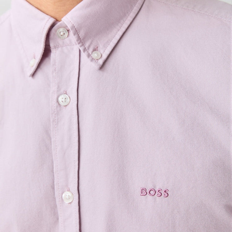 Close-up of a light purple shirt with 'BOSS' logo on a white background