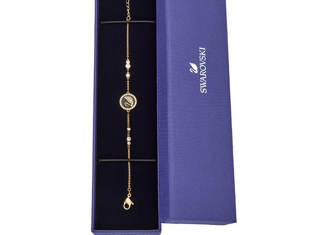 Swarovski Iconic Swan bracelet features a gold-tone plated chain