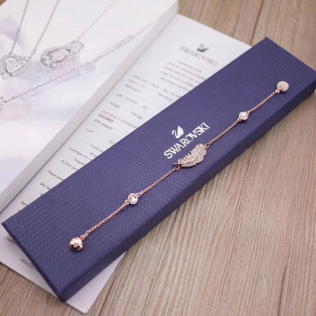 Swarovski Remix FeatStrand bracelet clear crystals and a central feather